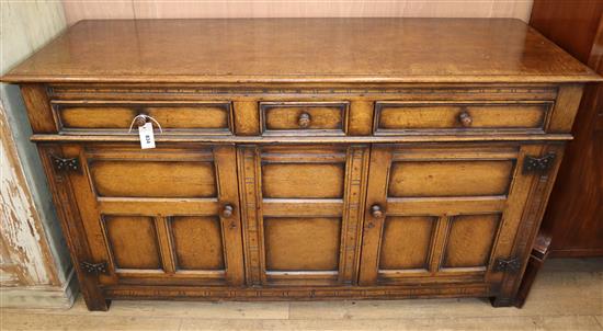 An 18th century style oak low dresser W.152cm